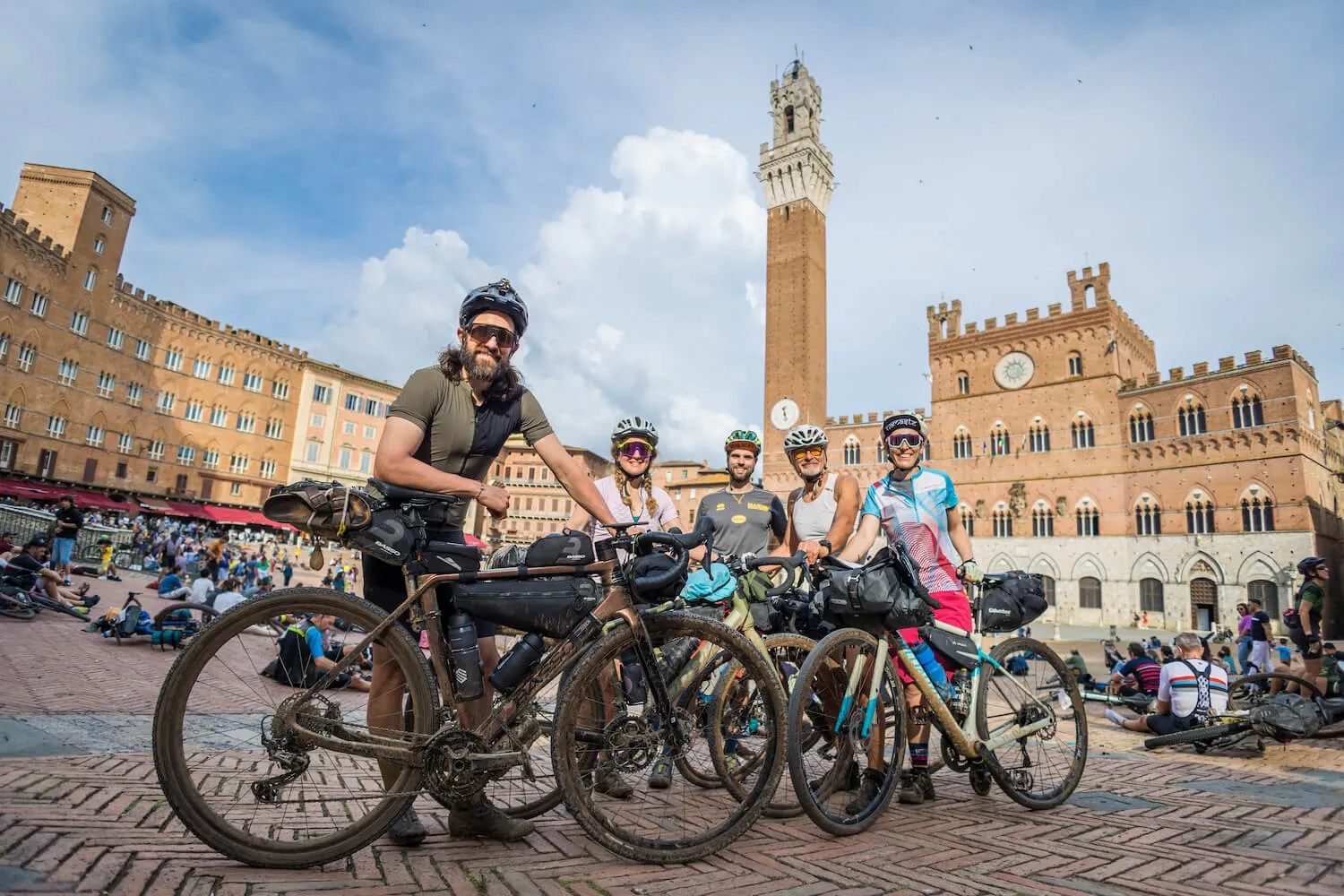 A group of riders in Siena's Piazza del Campo