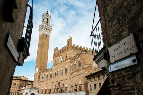 Siena's Torre del Mangia seen from an alley