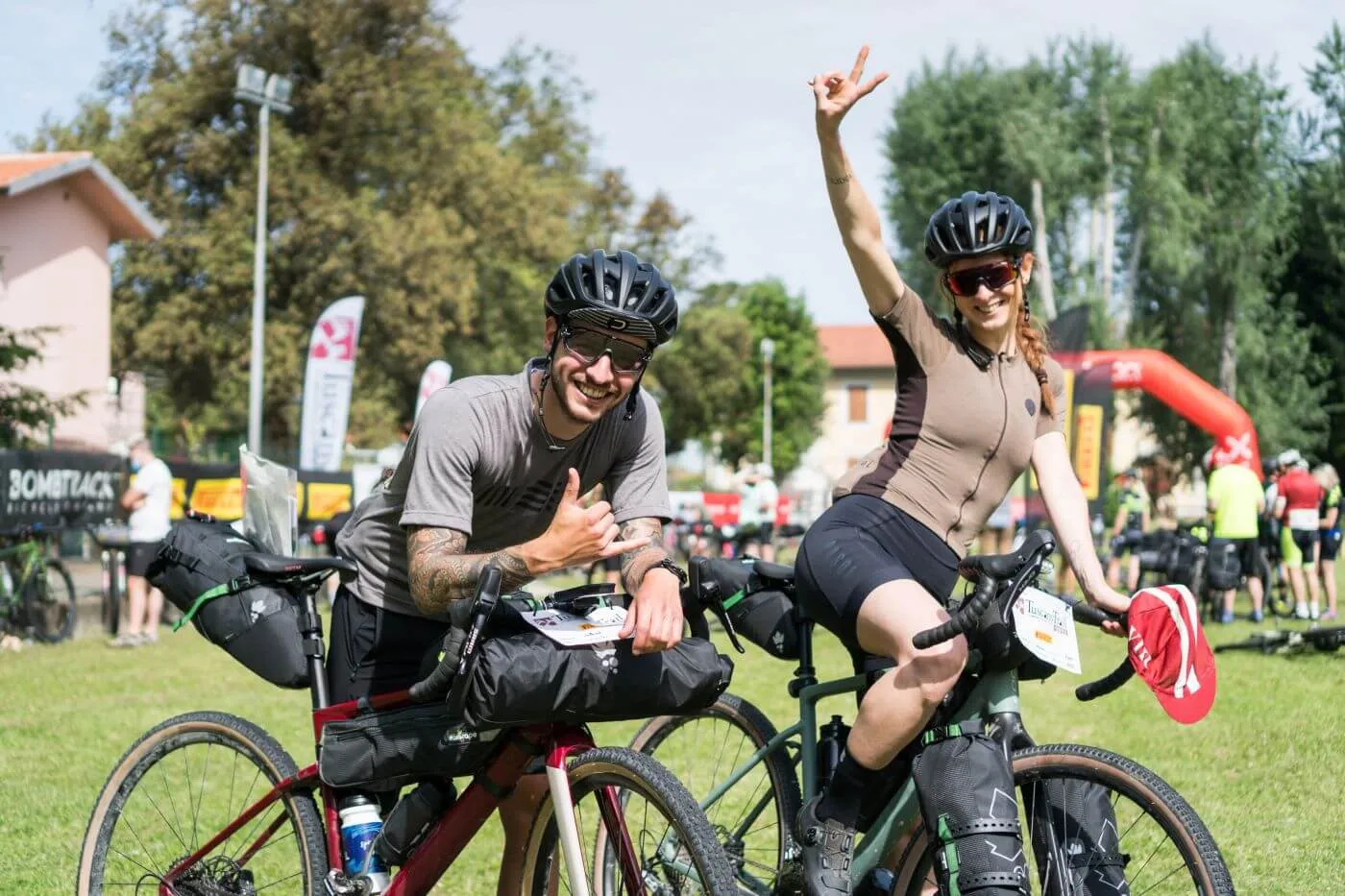 Riders waving at the start village